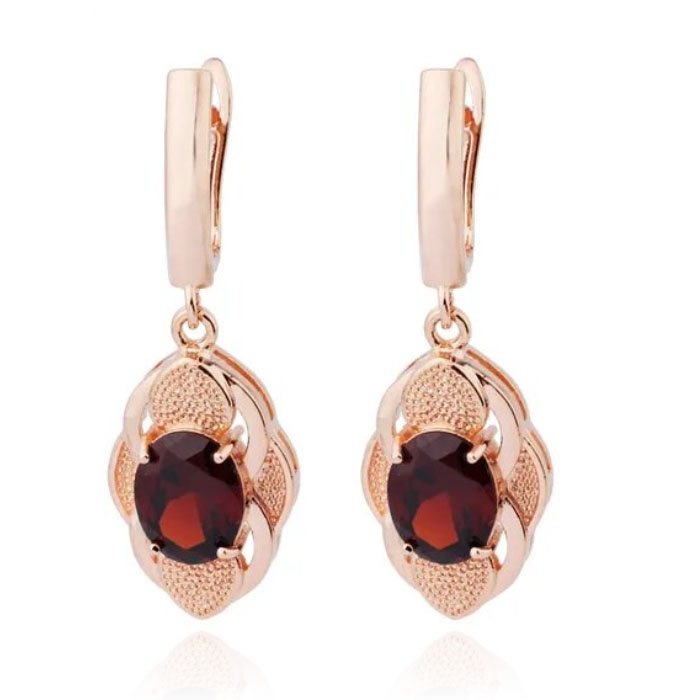 Deja Jewels Oorbellen met Ovale Hangers – Dames, Rosegoudkleurige Afwerking, Rode Glassteen