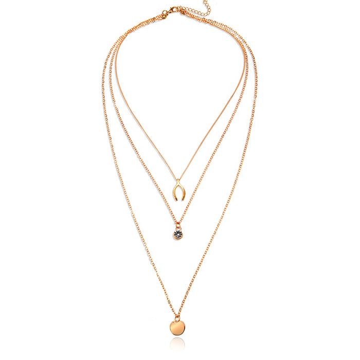 Gelaagde goudkleurige ketting Wishing Bone muntje en Zirkonia