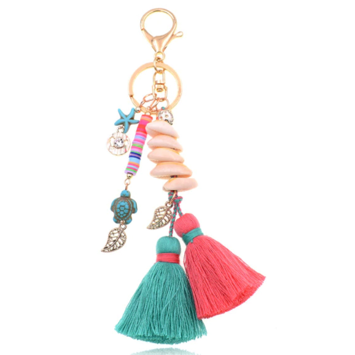 Handgemaakte Ibiza sleutelhanger goudkleurig roze turquoise met schelpjes